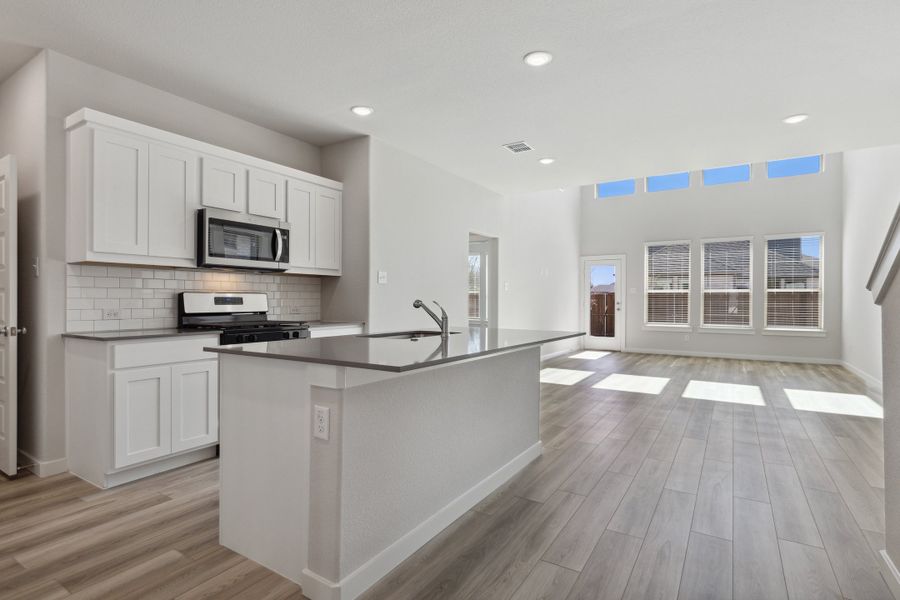 Kitchen in the Mesquite home plan by Trophy Signature Homes – REPRESENTATIVE PHOTO