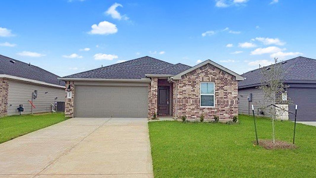 Front exterior of a new home in Tamarron, Fulshear, TX, highlighting curb appeal (Image 1).
