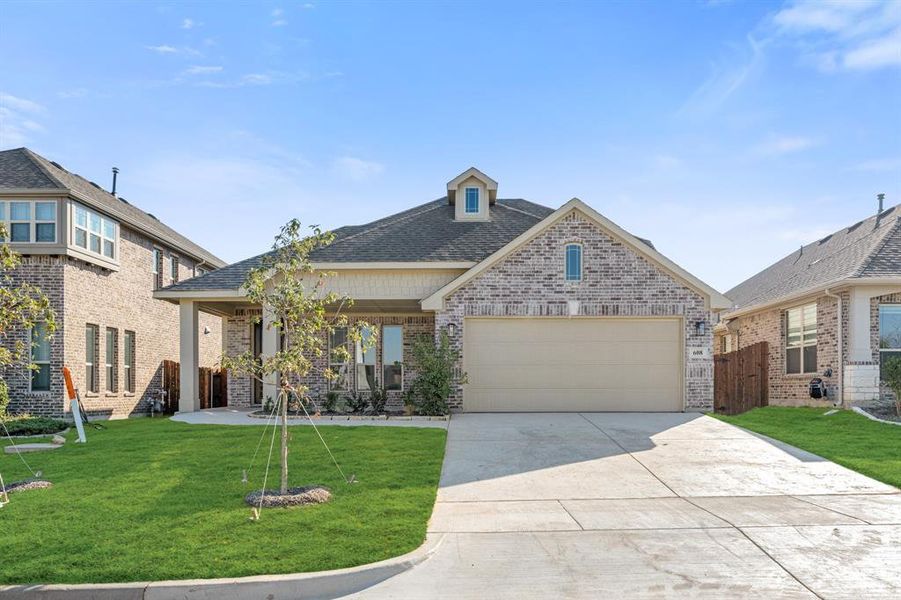 Front exterior of a new home in Godley Ranch Classic, Godley, TX, highlighting curb appeal (Image 1). Front exterior of a new home in Godley Ranch Classic, Godley, TX, highlighting curb appeal (Image 1).