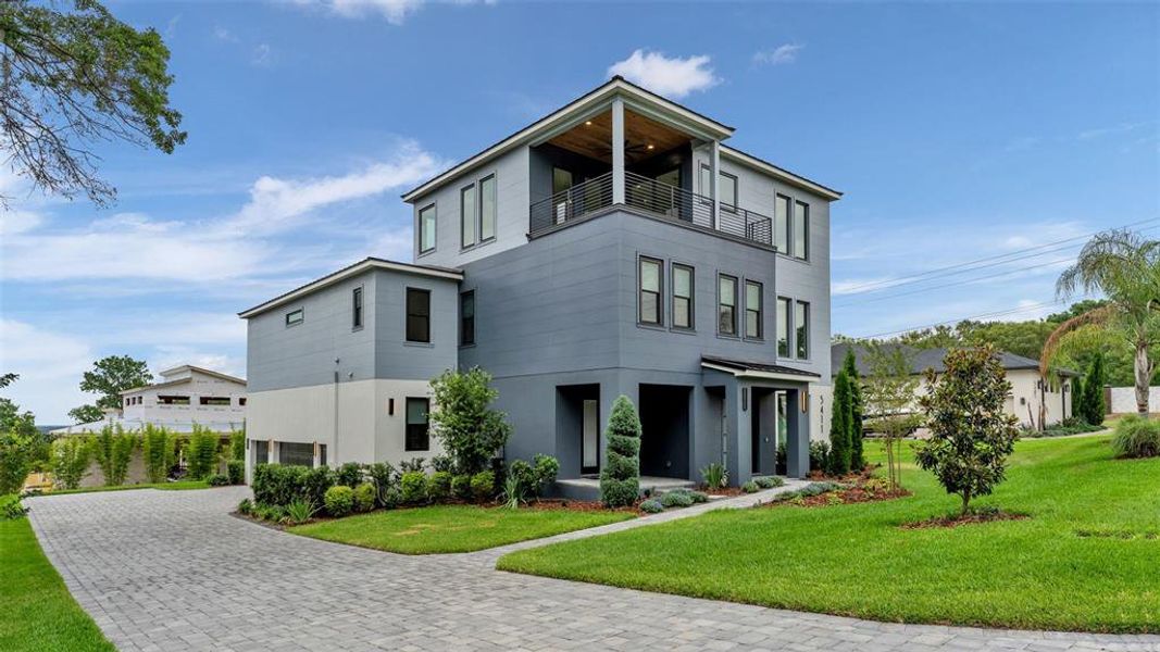 Front exterior of a new home in , Lakeland, FL, highlighting curb appeal (Image 26).