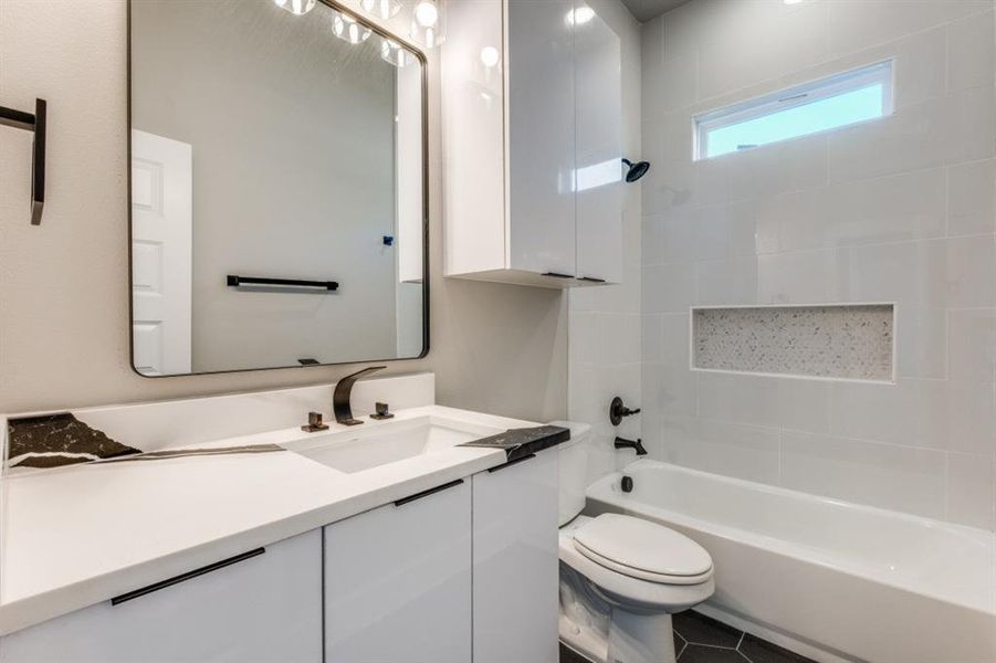 Bathroom featuring vanity and shower / bathtub combination