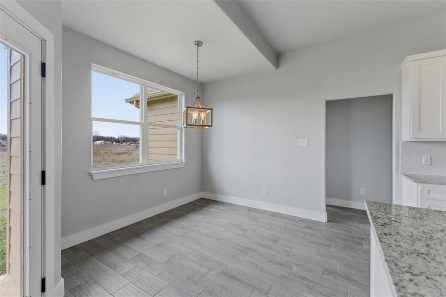 Dining area conveniently located near the kitchen and living spaces. Dining area conveniently located near the kitchen and living spaces.