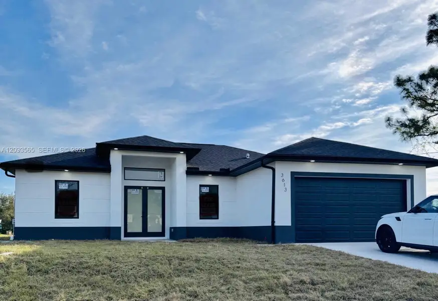 Front exterior of a new home in , Lehigh Acres, FL, highlighting curb appeal (Image 2). Front exterior of a new home in , Lehigh Acres, FL, highlighting curb appeal (Image 2).