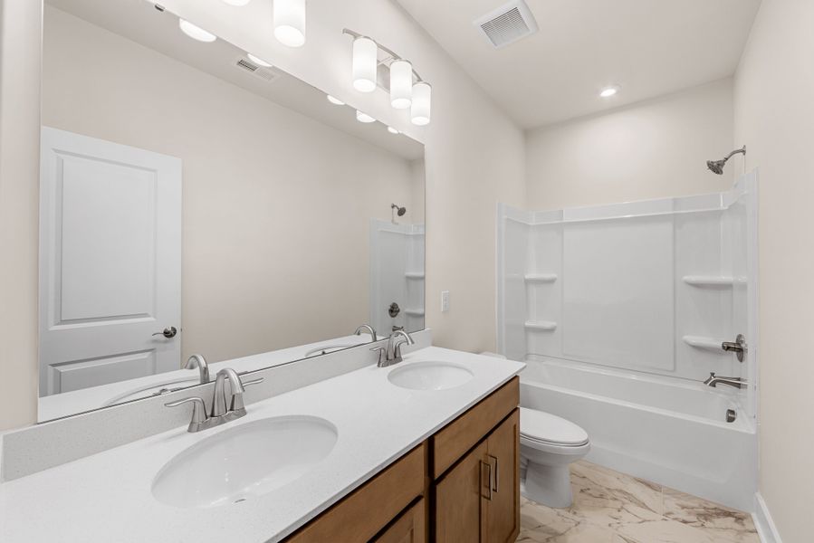 Furnished interior view inside a new home in Seven Oaks, Belmont (Image 12).