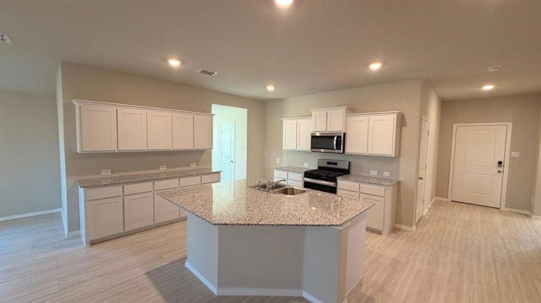 Kitchen- All Home and community information, including pricing, included features, terms, availability and amenities, are subject to change at any time without notice or obligation. All Drawings, pictures, photographs, video, square footages, floor plans, elevations, features, colors and sizes are approximate for illustration purposes only and will vary from the homes as built.