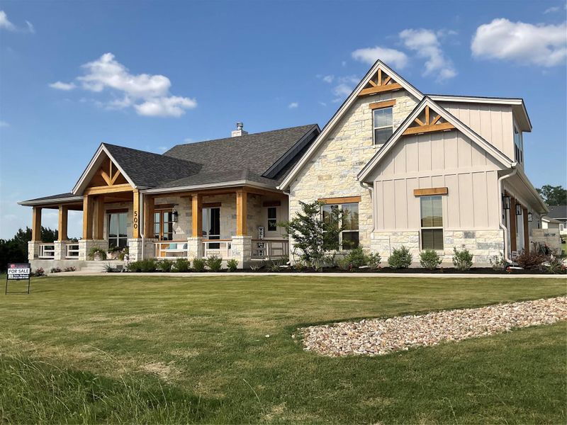 Front exterior of a new home in , Liberty Hill, TX, highlighting curb appeal (Image 2).