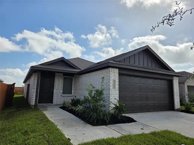 Front exterior of a new home in Emberly: Cottage Collection, Beasley, TX, highlighting curb appeal (Image 2). Front exterior of a new home in Emberly: Cottage Collection, Beasley, TX, highlighting curb appeal (Image 2).