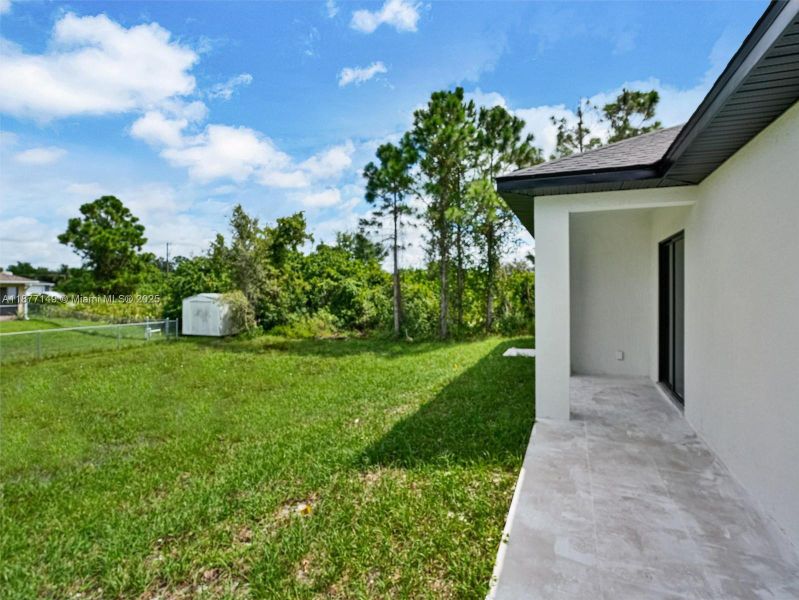 Front exterior of a new home in , Lehigh Acres, FL, highlighting curb appeal (Image 17).
