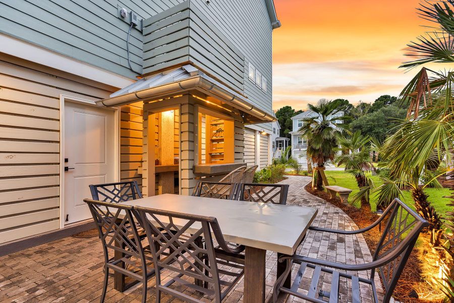 Exterior details and patio area of a home in Overlook at Copahee Sound, Awendaw (Image 32).