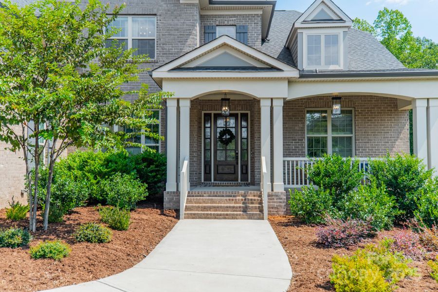 Front exterior of a new home in , Waxhaw, NC, highlighting curb appeal (Image 20).