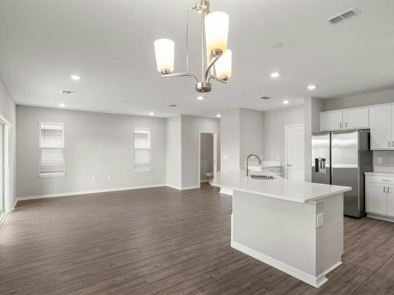 Inside, enjoy a sunny, open living area with low-maintenance LVP flooring.