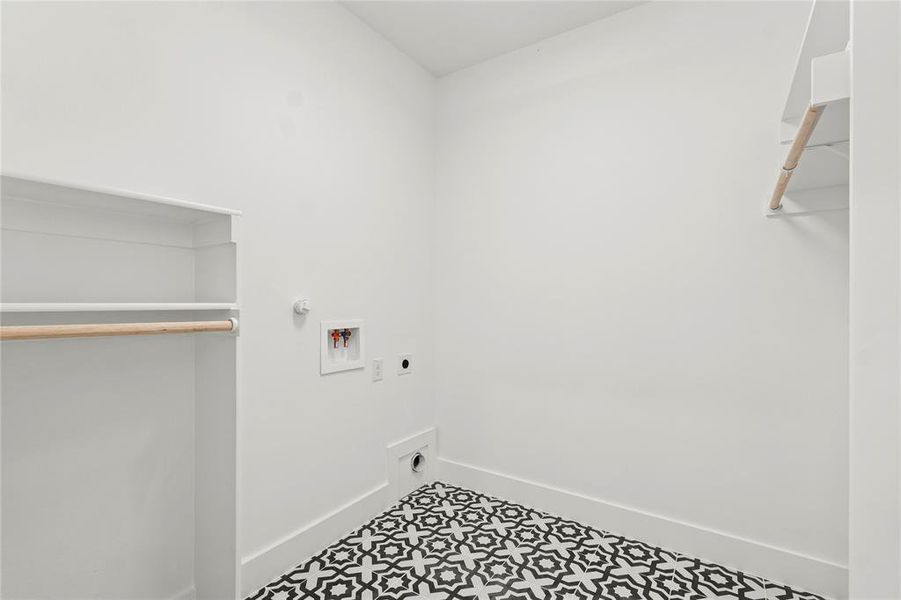 Laundry area featuring washer hookup, hookup for an electric dryer, tile patterned flooring, and hookup for a gas dryer