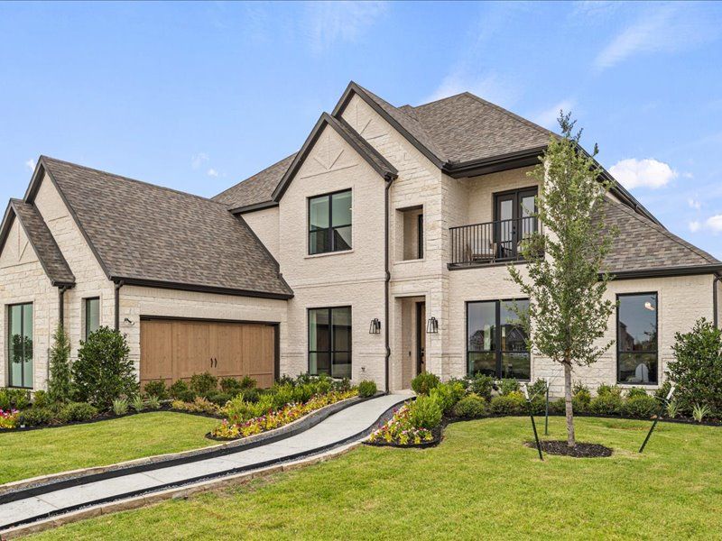 Front exterior of a new home in Nelson Lake Estates, Rockwall, TX, highlighting curb appeal (Image 2).