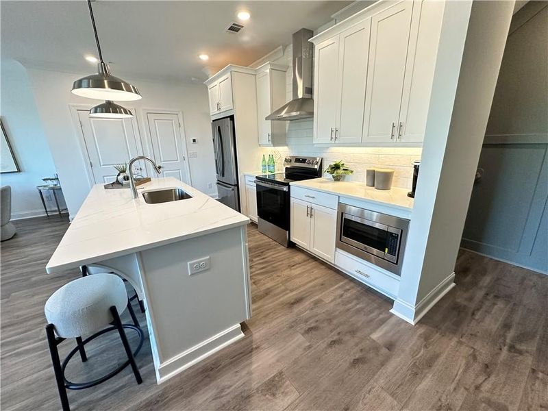 8ft quartz island with soft close cabinets *photos are from the Magnolia model at different home site*