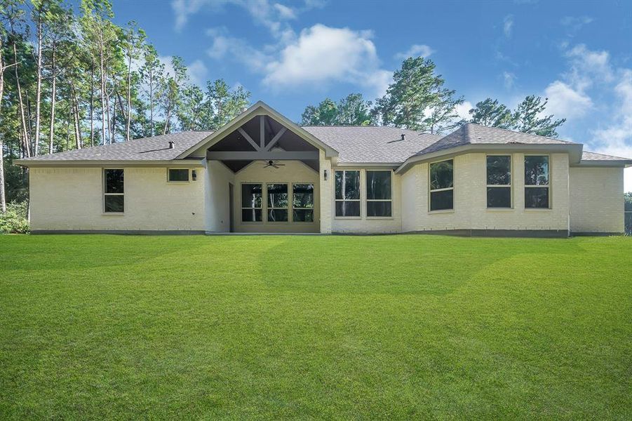 Covered back patio and plenty of room for a pool AND shop!