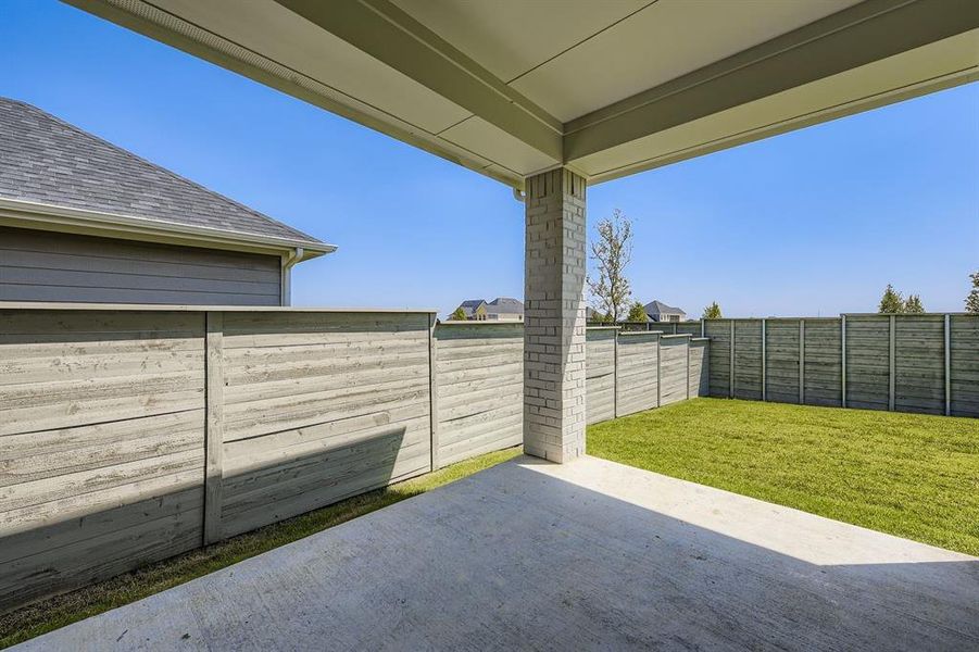 Fenced backyard with a patio Fenced backyard with a patio