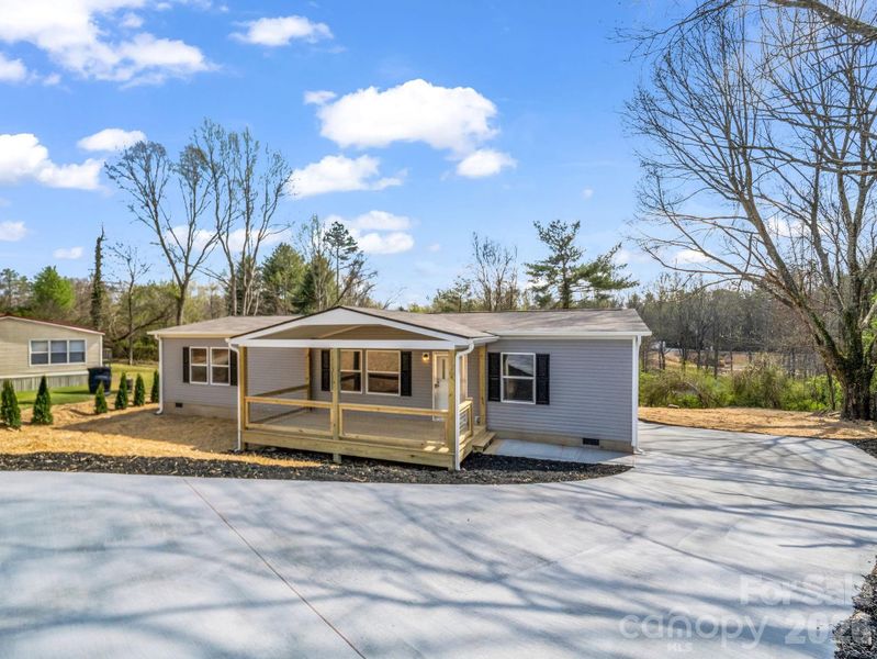 Exterior details and patio area of a home in , East Flat Rock (Image 14).
