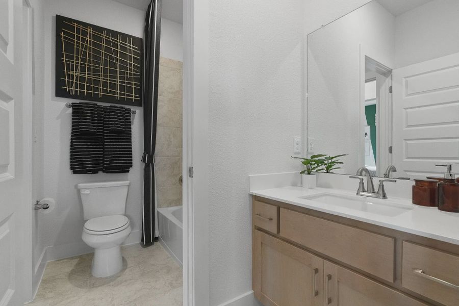 Representative furnished interior of a home built from the Madison by Chesmar Homes in Lakes of Cane Island, Katy (Image 17).