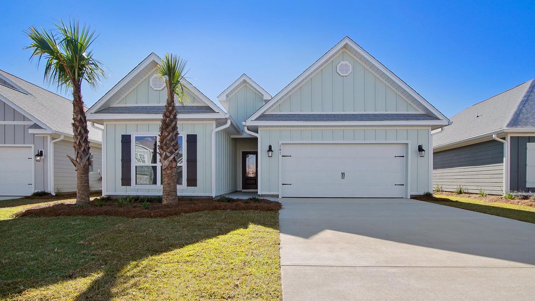 Front exterior of a new home in Caballeros Estates At Hombre, Panama City Beach, FL, highlighting curb appeal (Image 2).