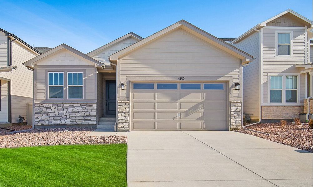 Front exterior of a new home in Trails at Aspen Ridge-3, Colorado Springs, CO, highlighting curb appeal (Image 24).