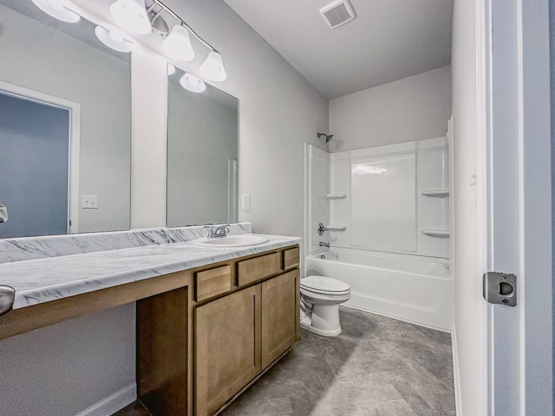 Representative furnished interior of a home built from the The Hampton by Smith Douglas Homes in Enclave at Willis, Willis (Image 11).