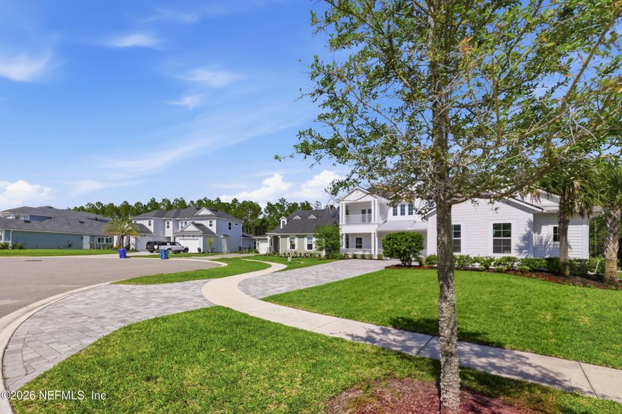 Front exterior of a new home in , Ponte Vedra, FL, highlighting curb appeal (Image 27).