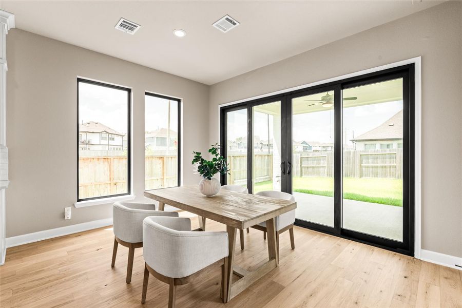 Ideal breakfast area that extends the gathering onto your covered patio. *Virtually Staged*