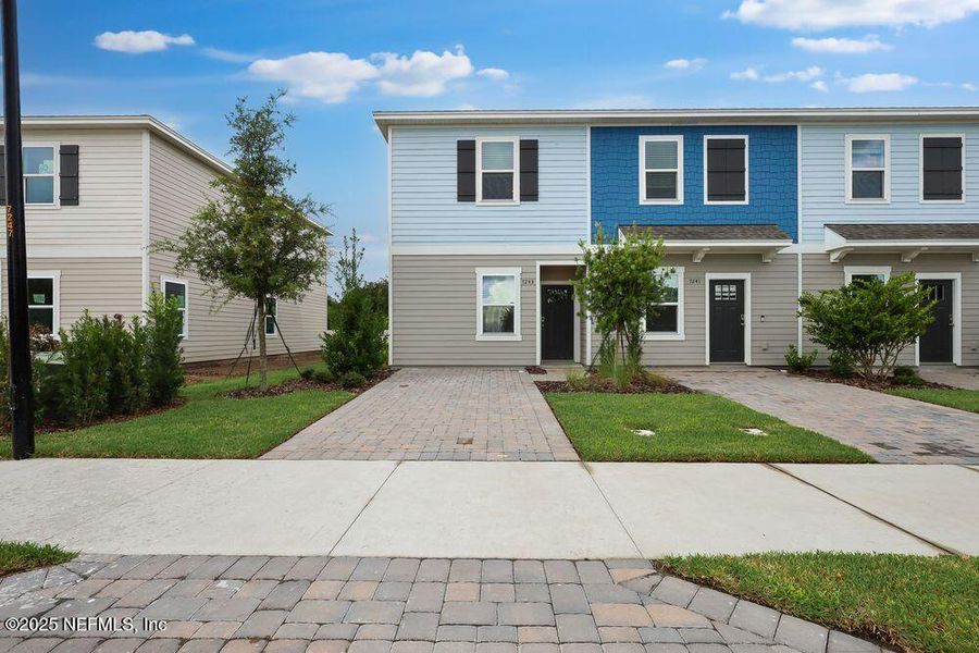 Front exterior of a new home in Sabal Terrace, Jacksonville, FL, highlighting curb appeal (Image 1).