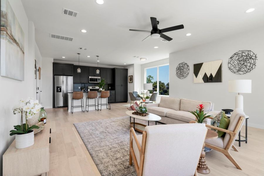 Living area with recessed lighting, light wood-style floors, and ceiling fan