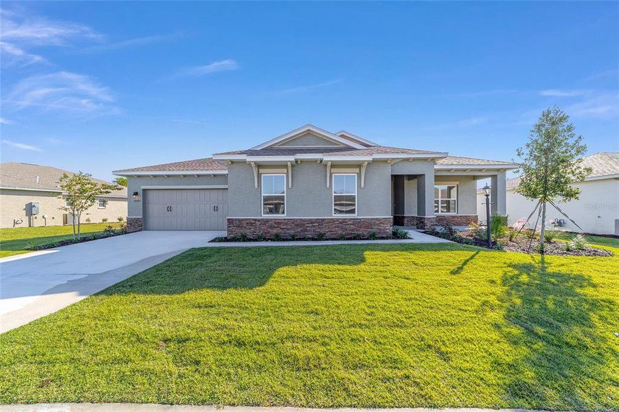 Front exterior of a new home in On Top of the World Communities, Ocala, FL, highlighting curb appeal (Image 22).