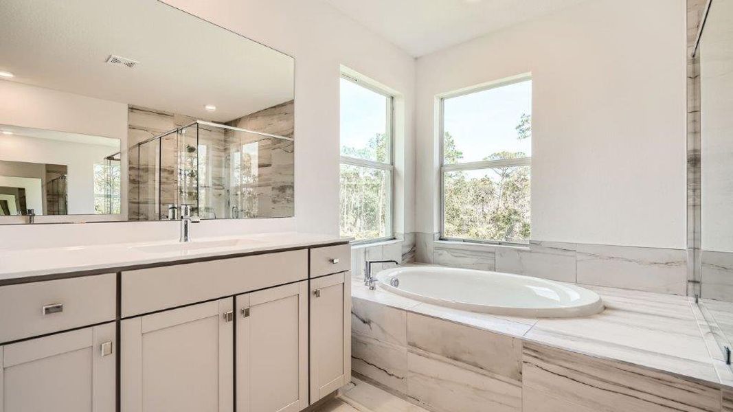 Representative furnished interior of a home built from the Ponte Vedra by D.R. Horton in Preserves at Park Trace, Stuart (Image 9).