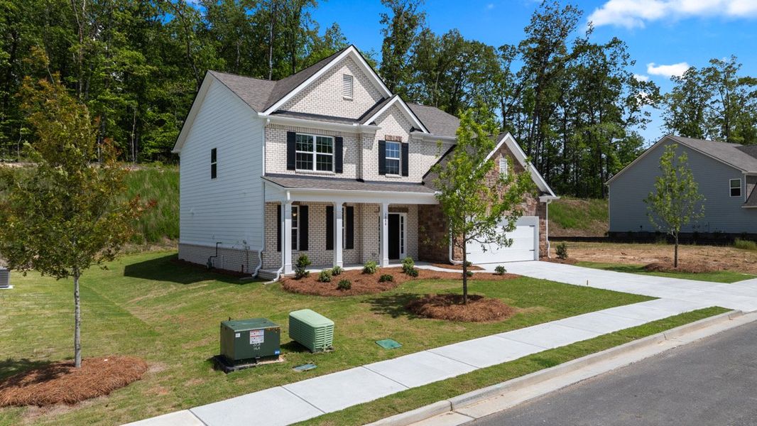 Representative exterior photo of a completed home built from the LYNNBROOK by D.R. Horton in Butner Estates, South Fulton, GA (Image 16).