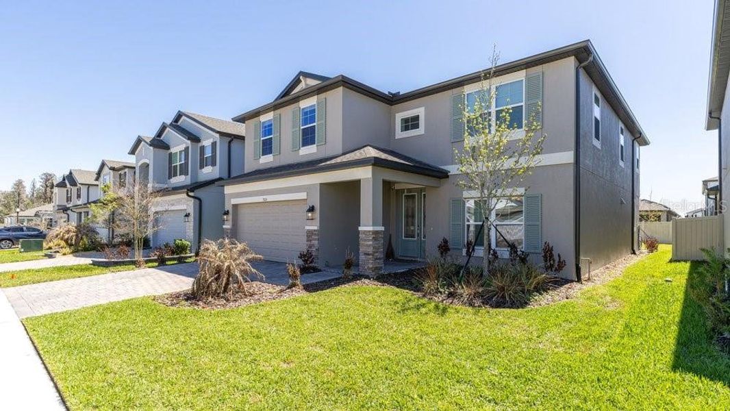 Front exterior of a new home in , Wesley Chapel, FL, highlighting curb appeal (Image 1). Front exterior of a new home in , Wesley Chapel, FL, highlighting curb appeal (Image 1).
