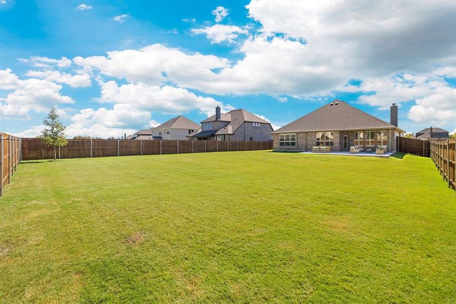 Exterior details and patio area of a home in Lovers Landing, Forney (Image 24).