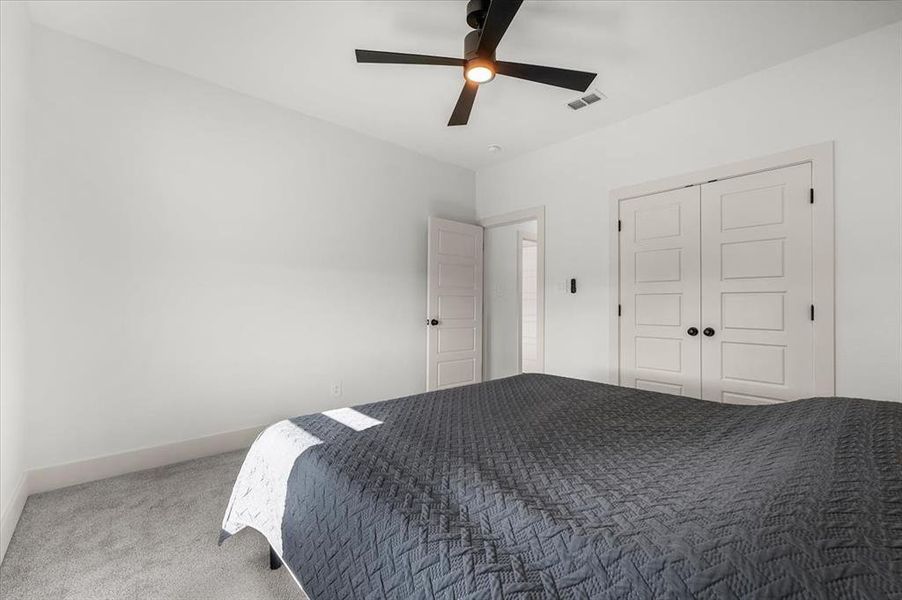 Large closet with double doors provides ample storage.