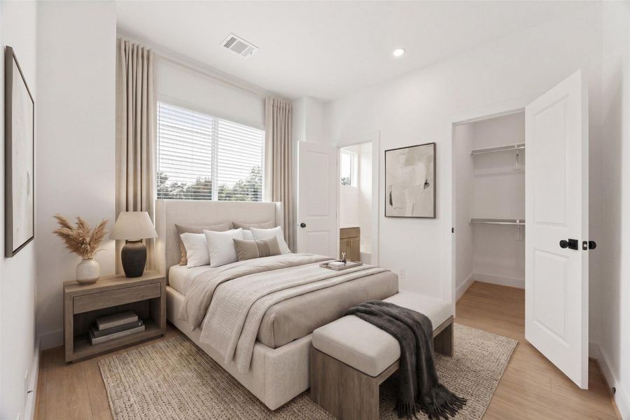 Spacious upper-level bedroom with high ceilings, recessed lighting, warm wood-look flooring, large windows, and a walk-in closet with built-in shelving. The neutral palette and generous proportions create a calm, comfortable retreat ready for a variety of furniture layouts and personal styling. This photo has been virtually staged for visual reference.