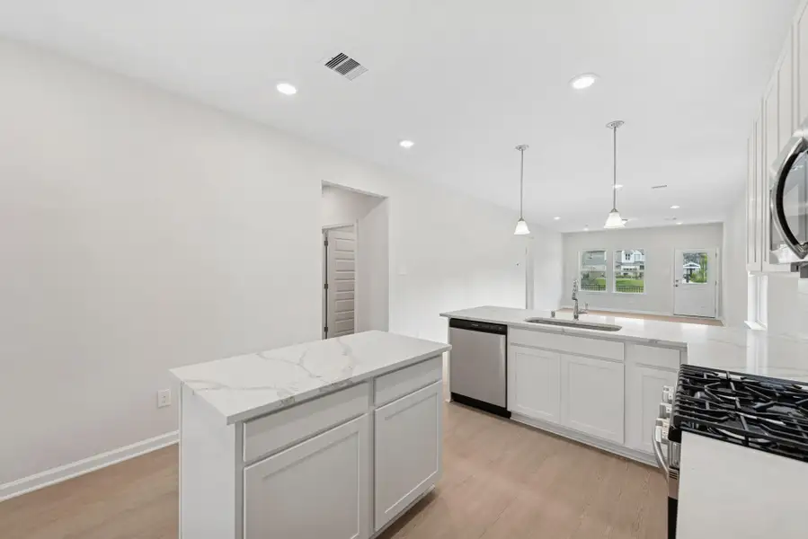 The Cardinal II- Kitchen. Photos of home shown are for illustration only; actual features, colors, and upgrades may vary.