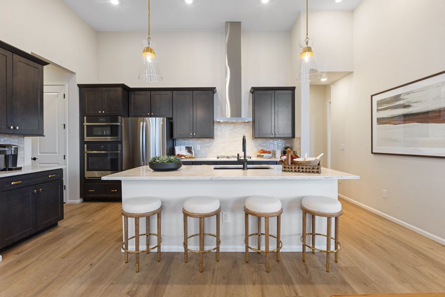 Representative furnished interior of a home built from the 5002 by Risewell Homes in The Estates Collection at Murphy Creek, Aurora (Image 9).