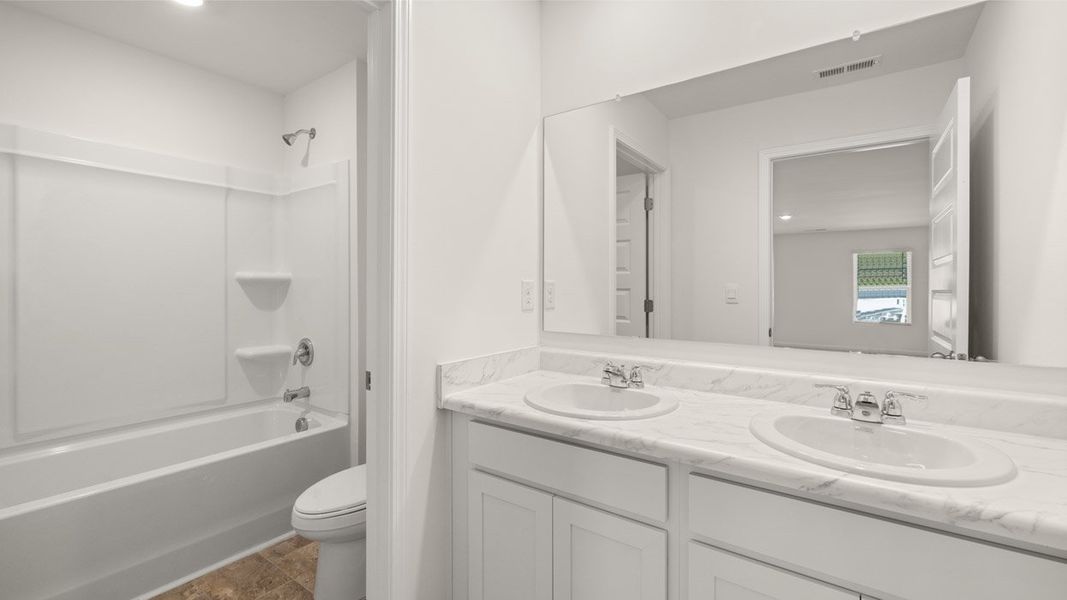 Representative unfurnished interior of a home built from the Mansfield by D.R. Horton in Brooks Station, Dacula (Image 32).