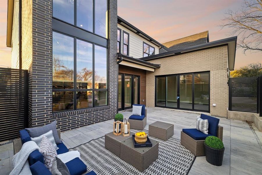 Patio terrace at dusk with an outdoor hangout area