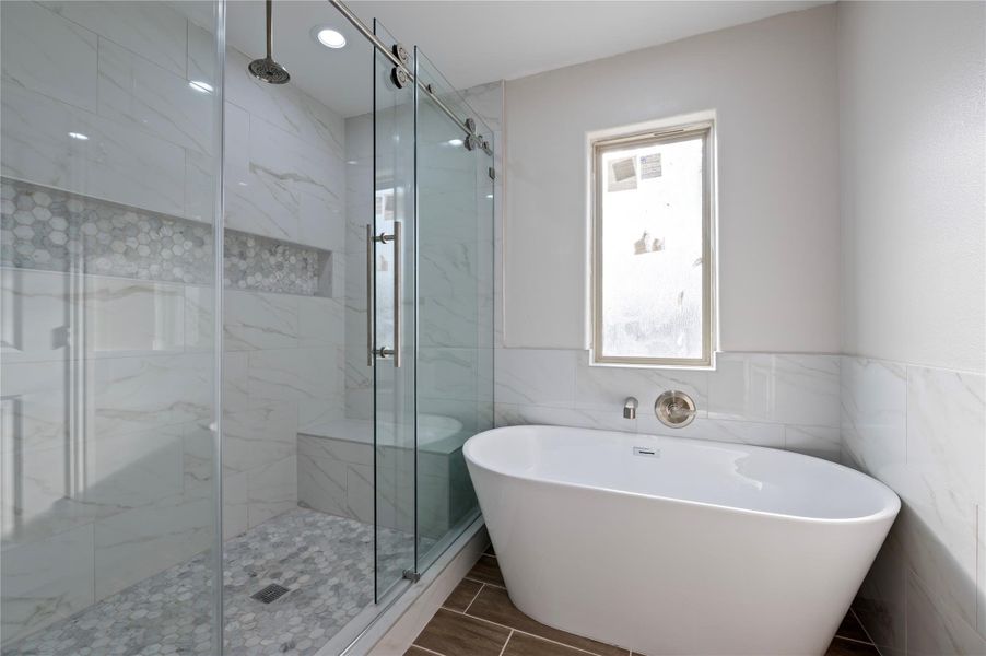 Luxury shower with spa-like tub.