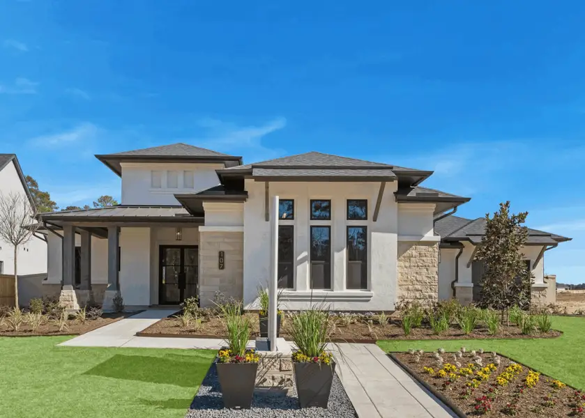 Front exterior of a new home in Audubon 80’s, Magnolia, TX, highlighting curb appeal (Image 2).