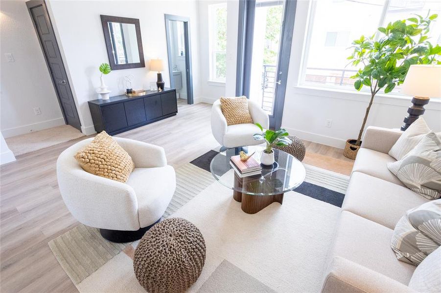 Living room with light hardwood / wood-style floors