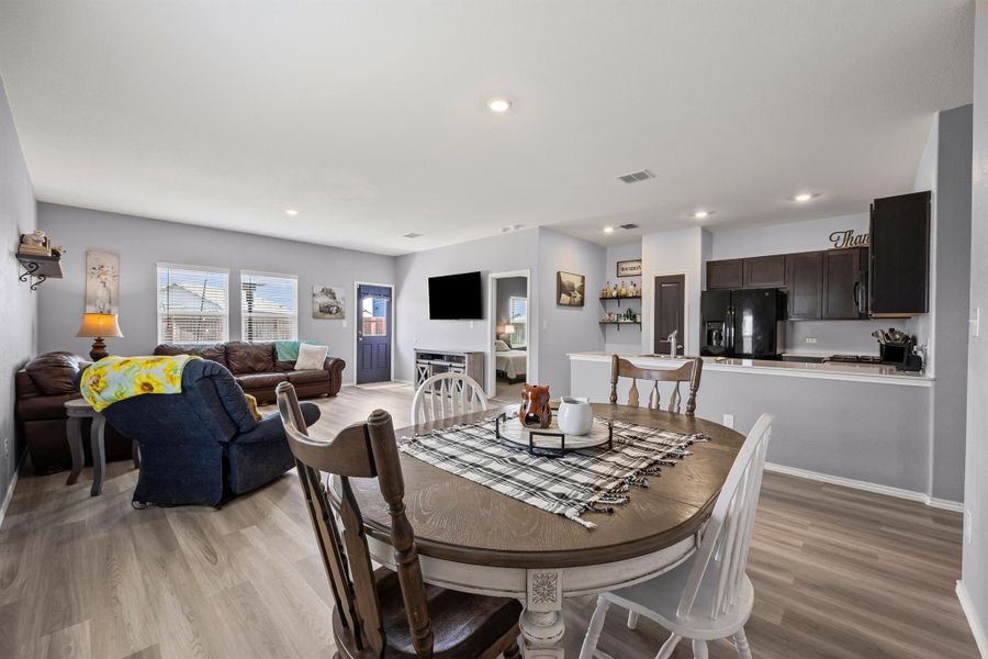 Dining area with LVP floors and open to the kitchen and living room Dining area with LVP floors and open to the kitchen and living room