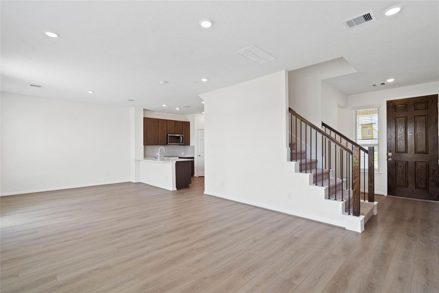 Stunning open-concept design seamlessly connecting the living, dining, and kitchen areas—perfect for both everyday living and entertaining! Stunning open-concept design seamlessly connecting the living, dining, and kitchen areas—perfect for both everyday living and entertaining!