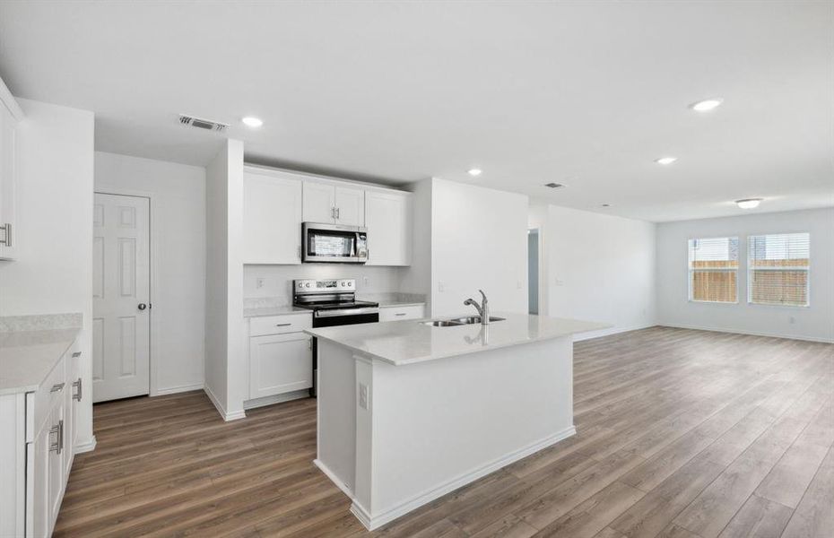 Airy kitchen with ample cabinet space *real home pictured