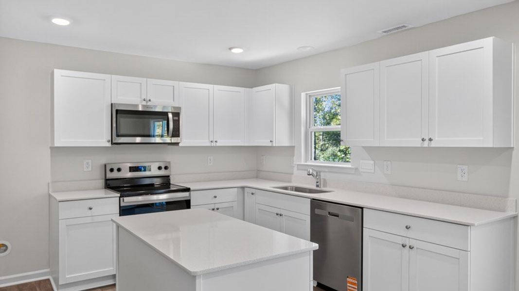 Representative furnished interior of a home built from the KYLE by D.R. Horton in Olive Branch, Clayton (Image 4).