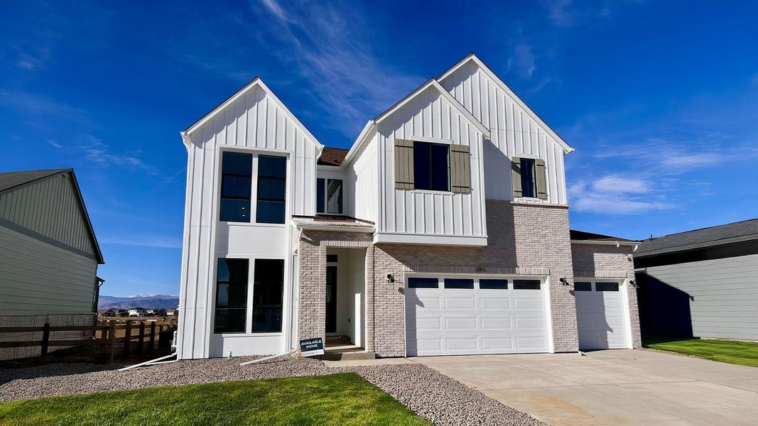 Front exterior of a new home in Kitchel Lake at Serratoga Falls, Timnath, CO, highlighting curb appeal (Image 2).