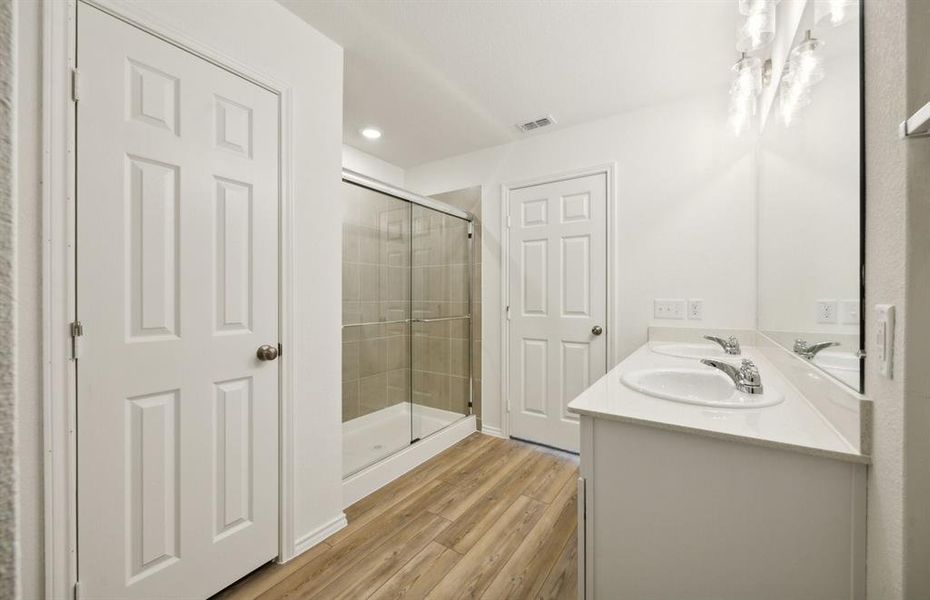 Owner's bath with dual vanity and oversized shower*real home pictured