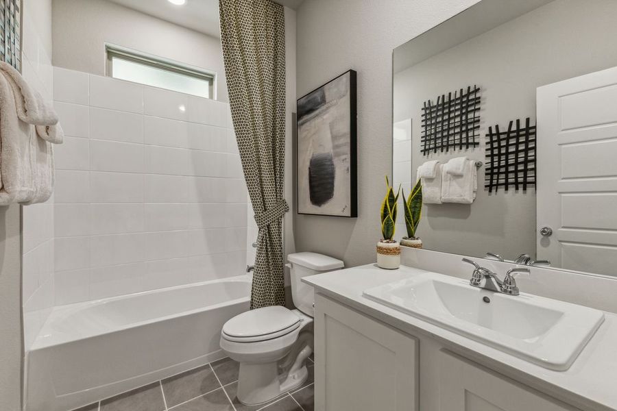 Bathroom in the Stanley II home plan by Trophy Signature Homes – REPRESENTATIVE PHOTO